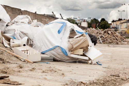 Photograph of a cleared garden with tidy piles of green waste ready for removal